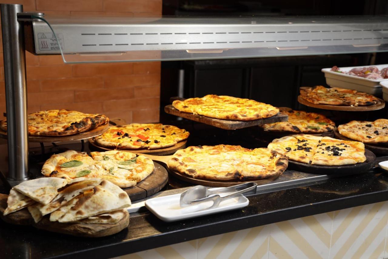 The Mirage Resort & Spa Hammamet Exterior foto A display of pies at a bakery